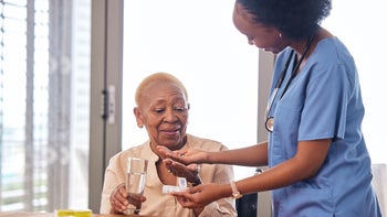 prednisone: medical professional giving medication 1739311191