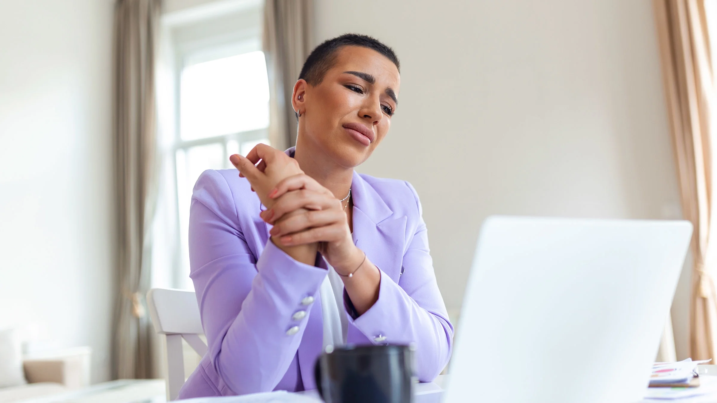 A person working from home with wrist pain.
