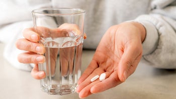 Medication Education: Dosage: closeup pills in womans hand 1360365883