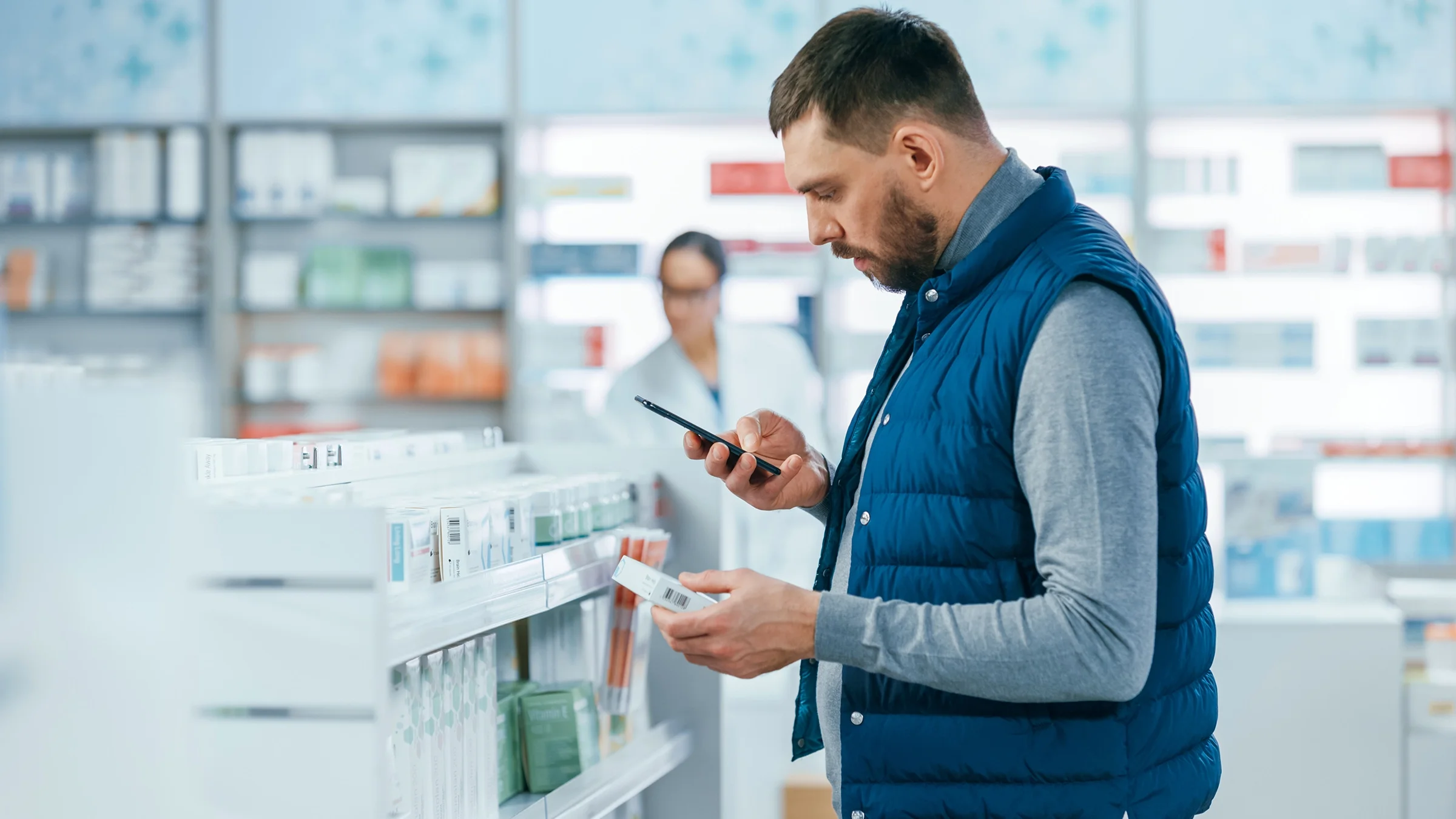A man shops at a pharmacy.