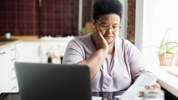 glp-1-agonists: woman reading paperwork 2166297109