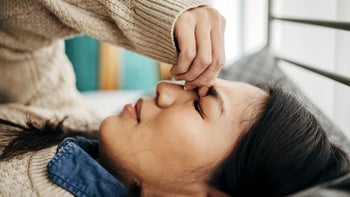 triptans: woman in bed with migraine 1453153745
