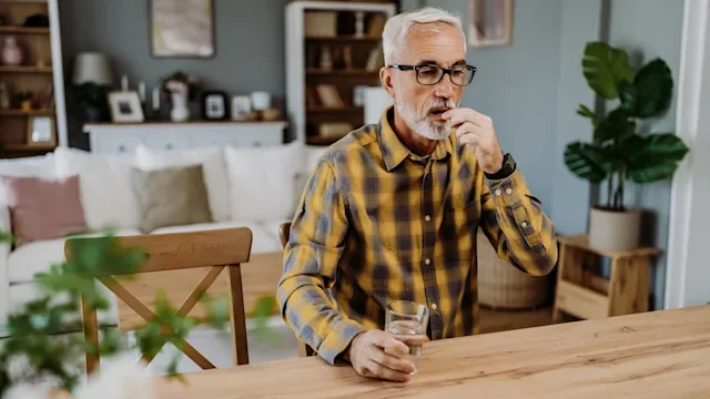 Anticoagulants: man taking medication 2216137939