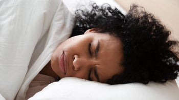 Flu: headache: woman with headache laying in bed 1264479220