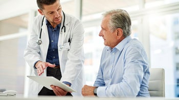 Cancer: doctor speaking to patient 1141974089