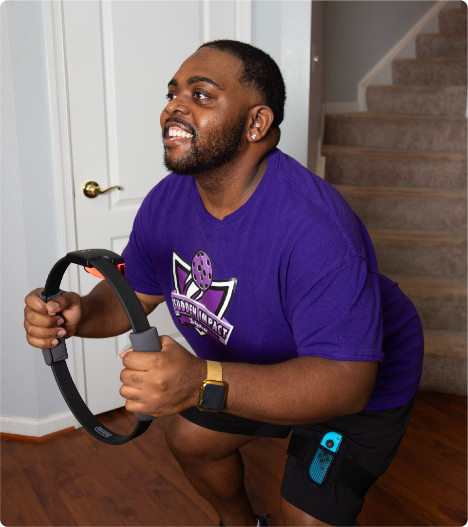 Shawn Pennix works out by playing fitness game “Ring Fit Adventure” on his Nintendo Switch. (Photo by Cielito M. Vivas/GoodRx Health)