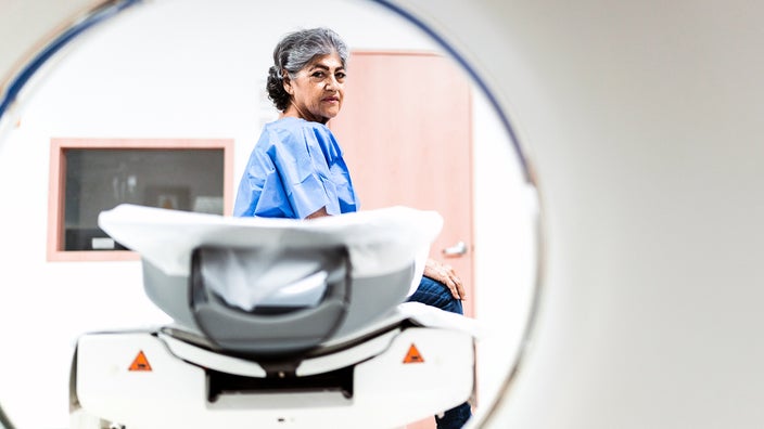 A woman waits for an MRI scan.