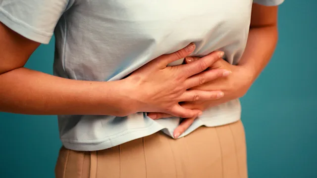 Gut health: closeup abdominal pain 2235552444