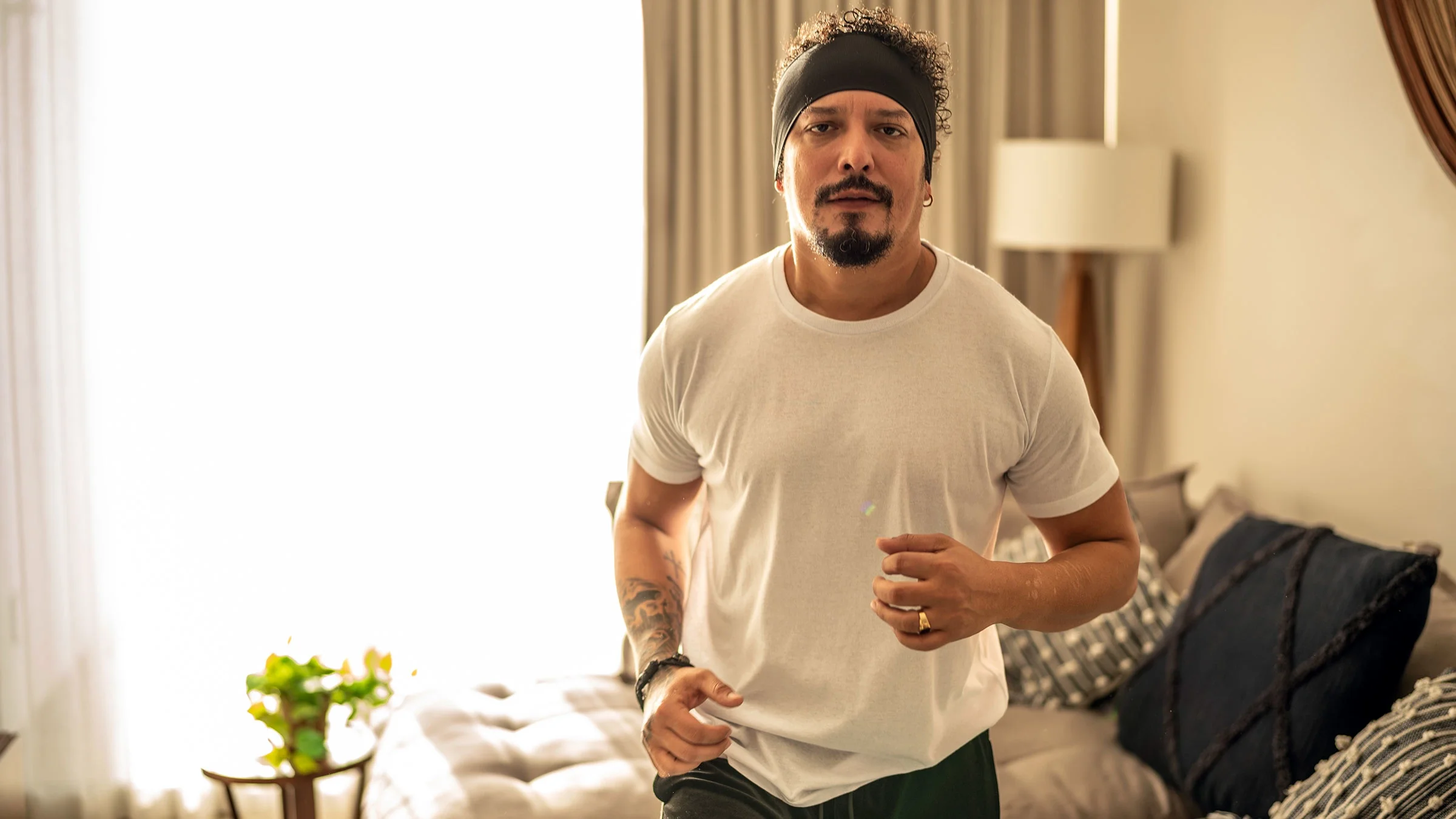 A man runs in place at home.