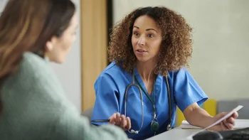 Medication Education: doctor speaking with patient 1401342653