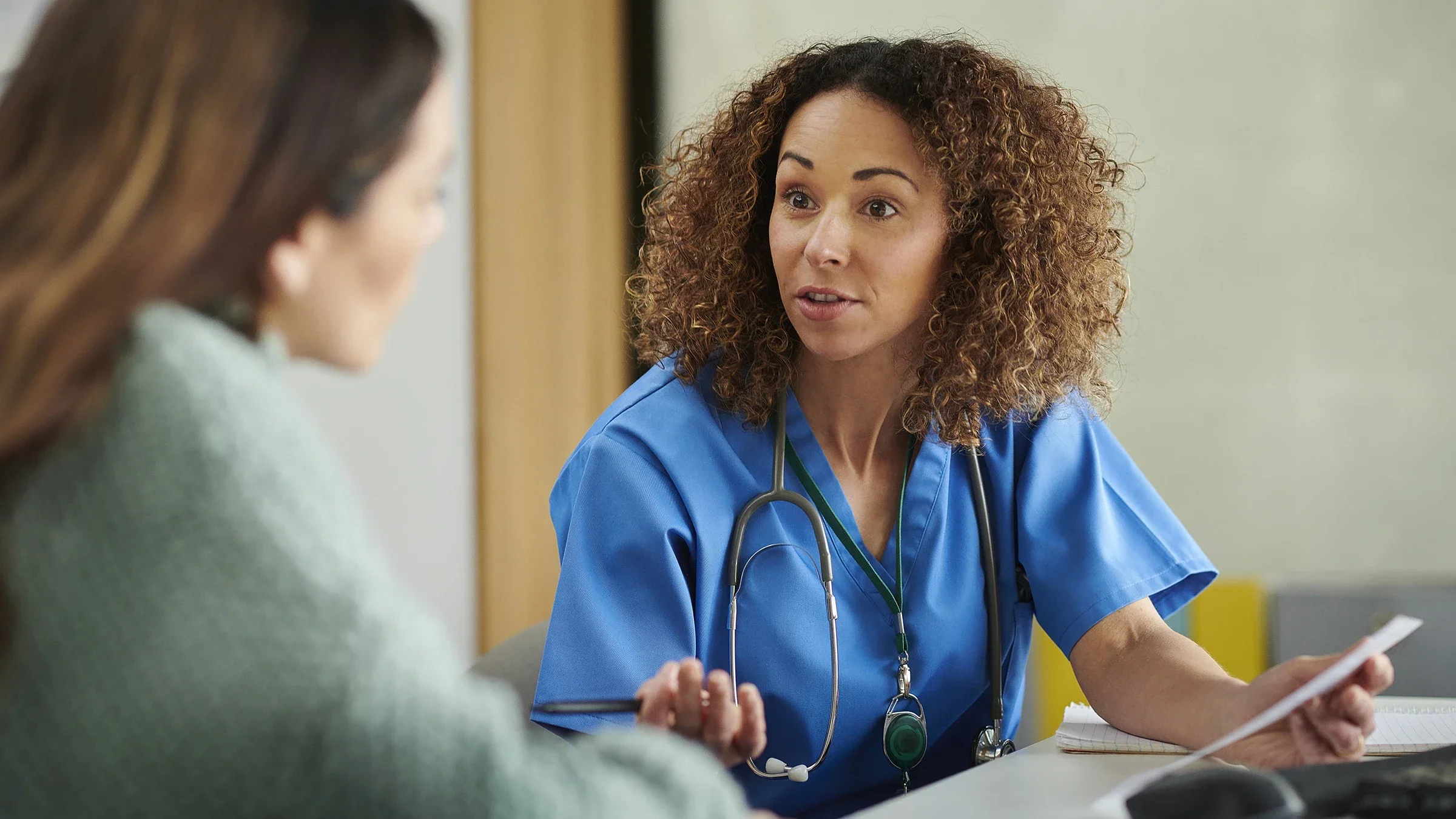A healthcare professional speaks with a patient. The medication Ozempic, used to treat Type 2 diabetes, has also been used for weight loss. However, the medication can pose a risk for people with eating disorders. 
sturti/E+ via Getty Images