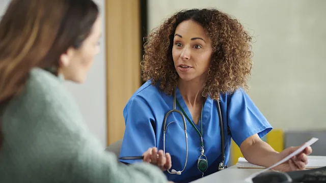 Medication Education: doctor speaking with patient 1401342653