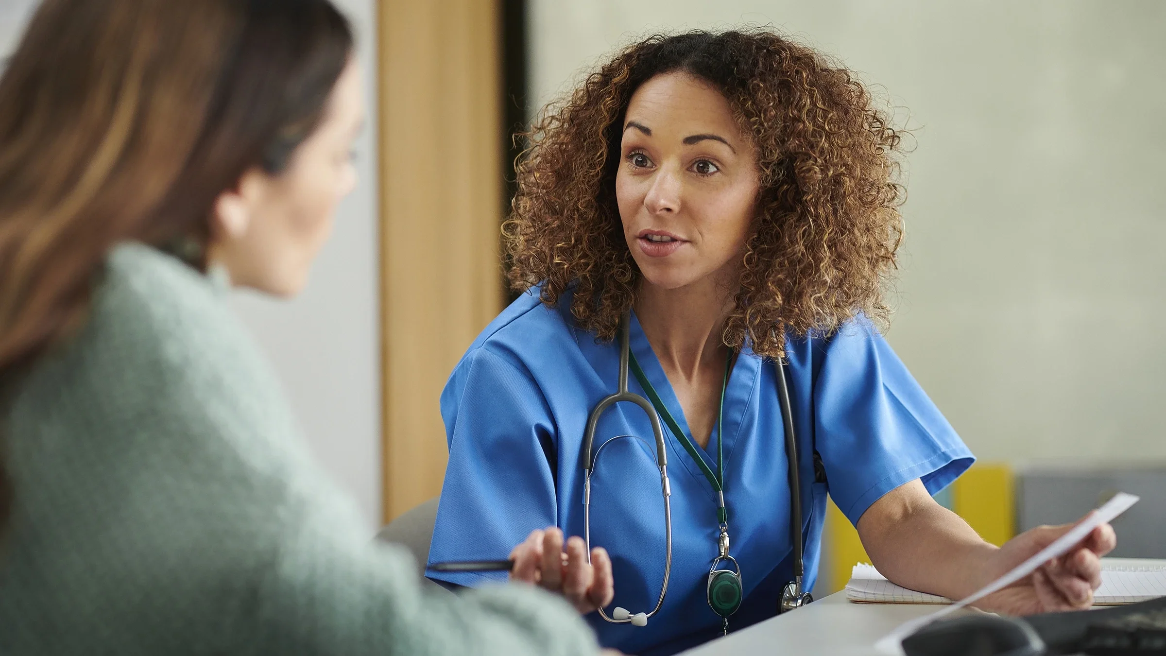 A healthcare professional speaks with a patient. The medication Ozempic, used to treat Type 2 diabetes, has also been used for weight loss. However, the medication can pose a risk for people with eating disorders. 