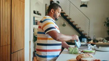 diabetes-type-2: man meal prepping at home 2223189841