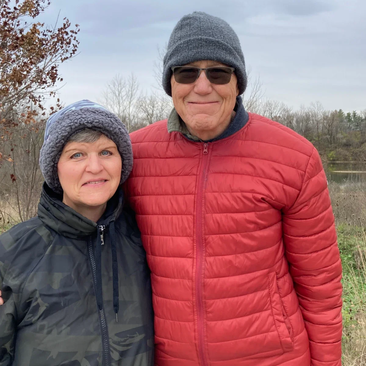 Rick Phillips and his wife, Sheryl, are pictured bundled up in hats and coats in a snapshot outside.