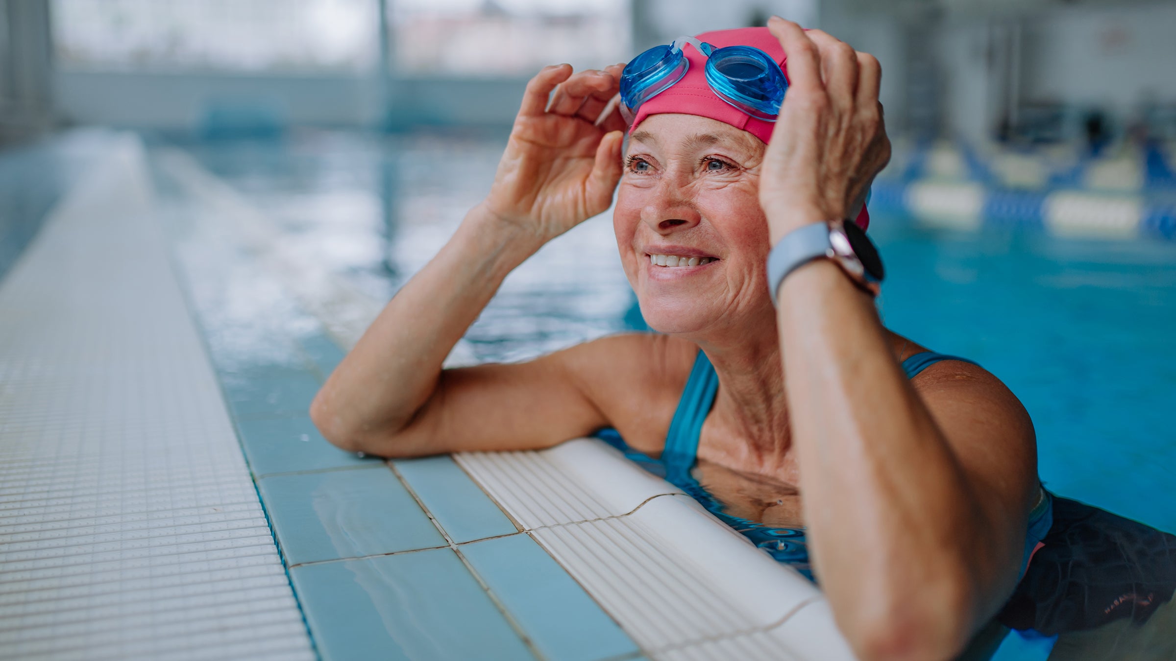 senior woman pool smiling-1364551940