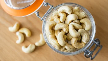 diet-nutrition: closeup cashews in glass jar 2213575389