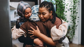 Mental health: 3 friends hugging-1351091079.jpg