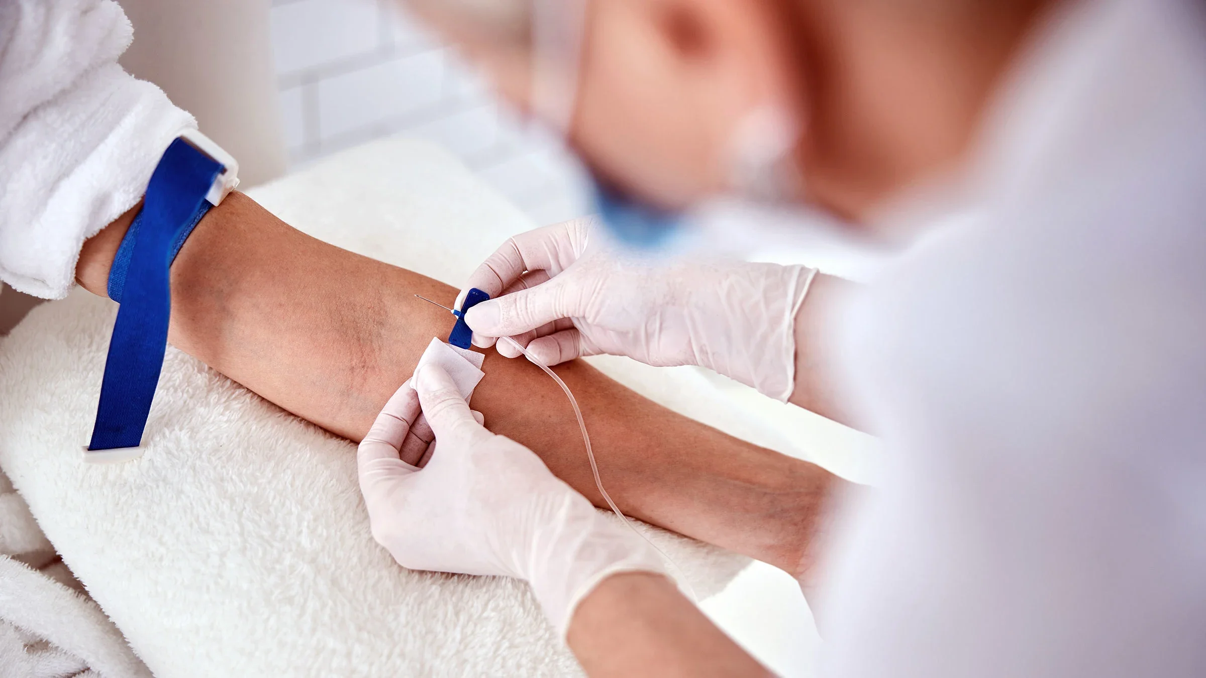 A person receives an IV infusion.
yacobchuk/iStock via Getty Images Plus 