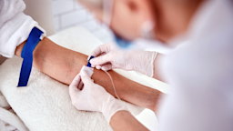 A person receives an IV infusion.
yacobchuk/iStock via Getty Images Plus 