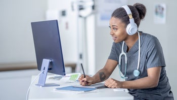 Providers: hcp taking notes telehealth appointment 1357744357