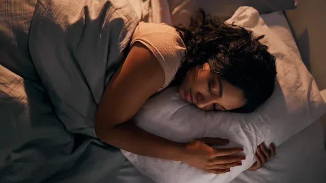 Health: Sleep: woman relaxing night sleep 1165075919