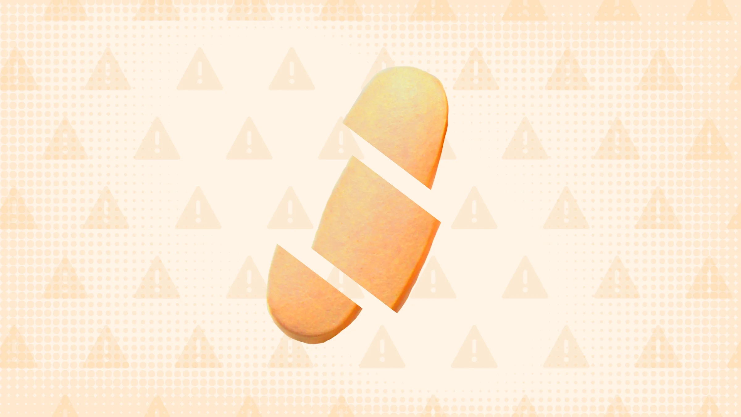 In the center of a light orange background with texture and warning sign pattern is a single orange pill cut into thirds. 