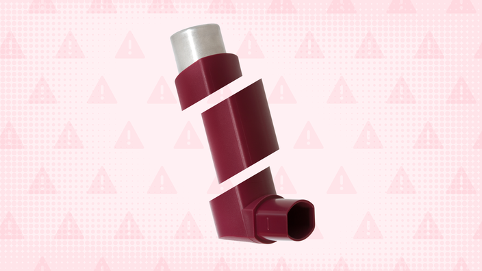 In the center of a light red background with texture and warning sign pattern is a red inhaler cut into thirds.