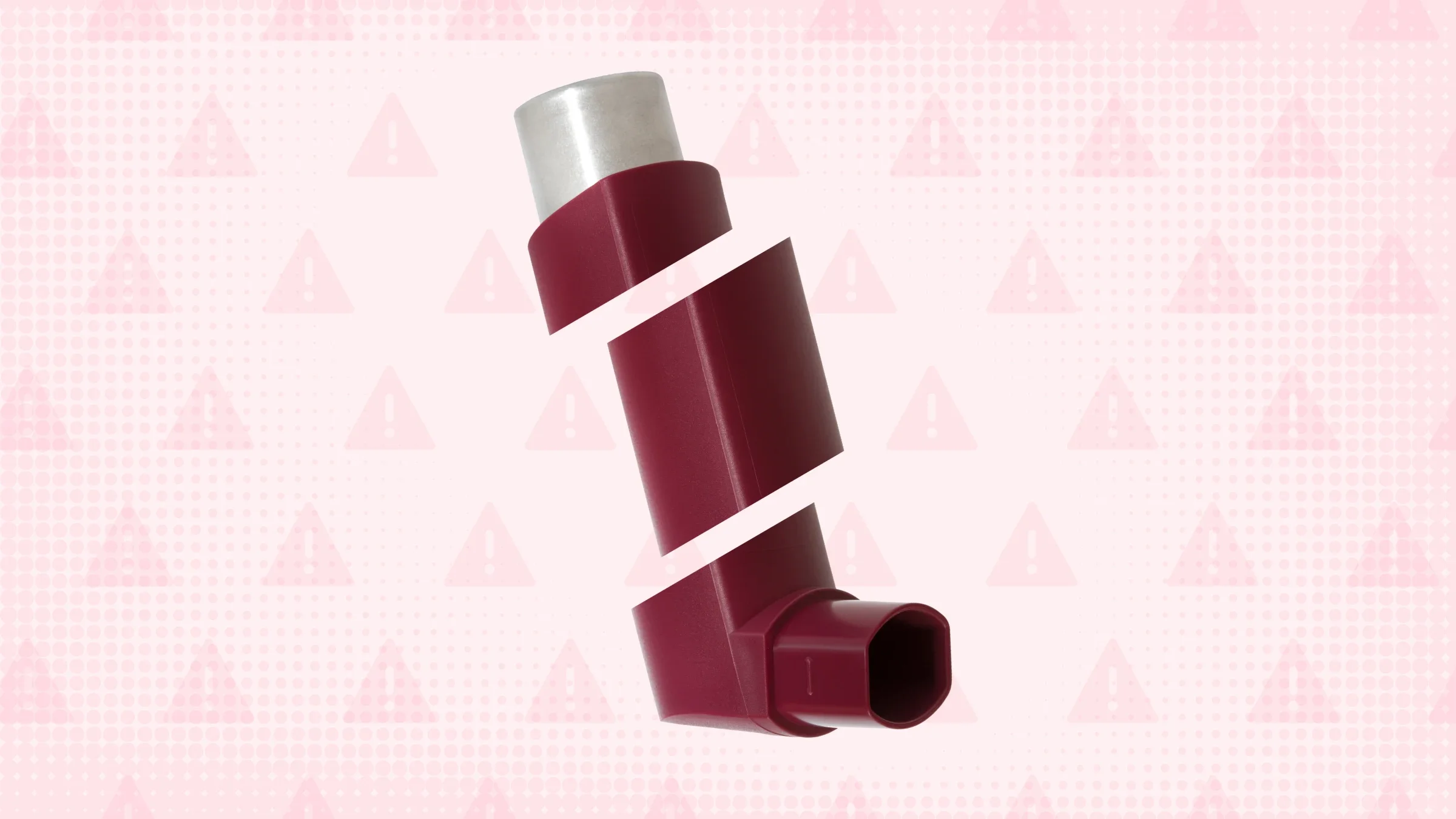 In the center of a light red background with texture and warning sign pattern is a red inhaler cut into thirds.
GoodRx Health