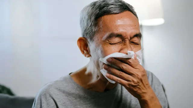 Health: Sinus infection: senior man blowing his nose 1606756958