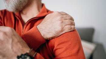 Joint: closeup man with shoulder pain 1466041655