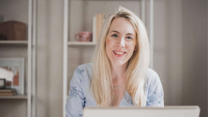 Portrait of Erika Page at her desk.