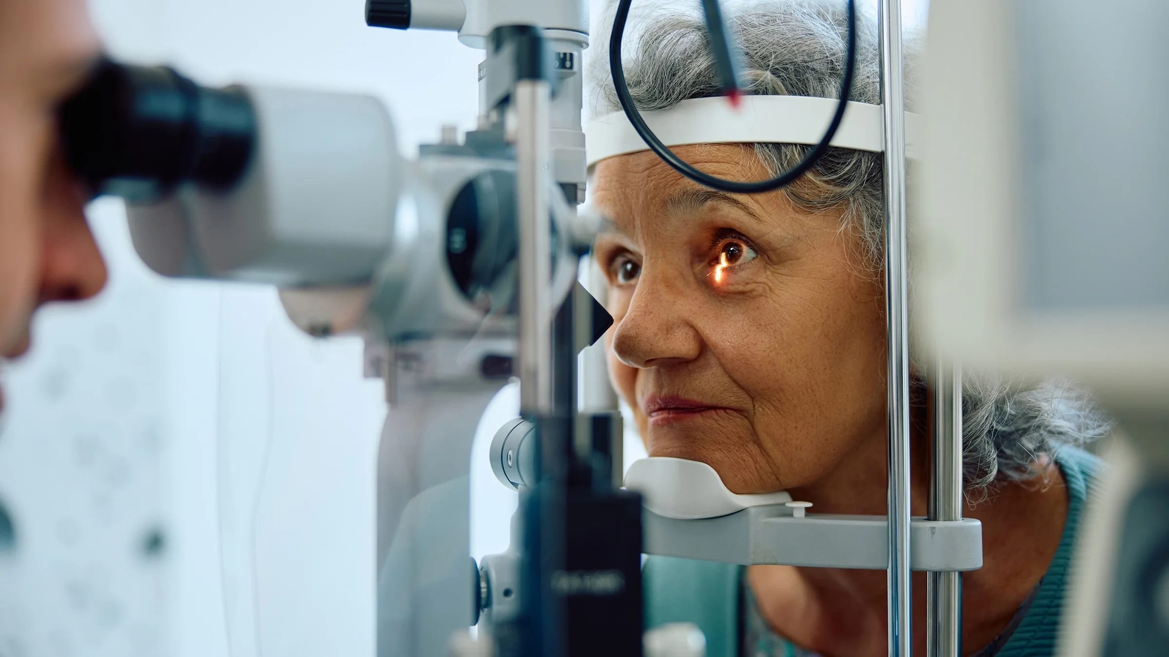 An older woman is at an eye appointment.