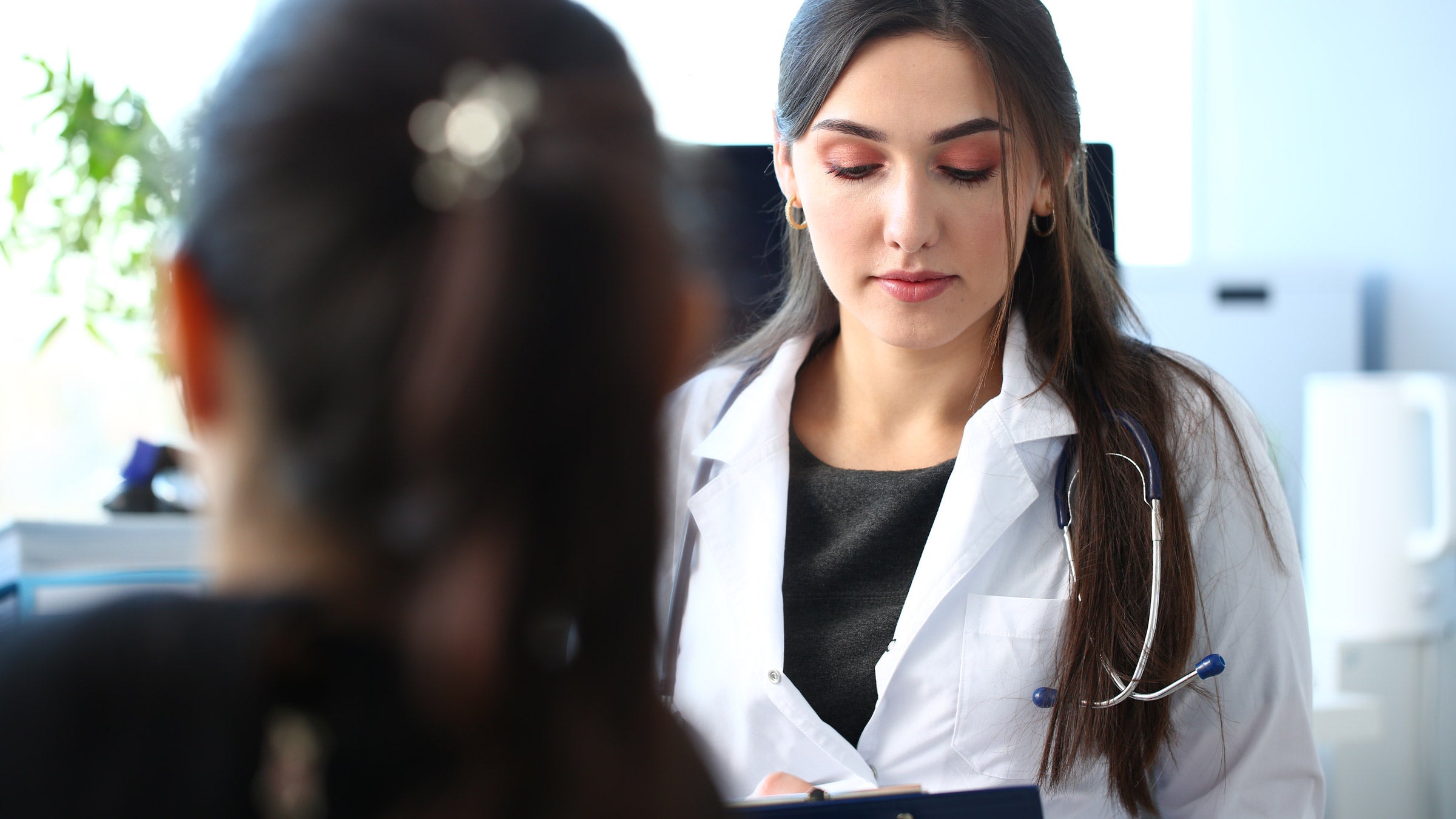 shingles: doctor speaking to patient taking notes 1171773131