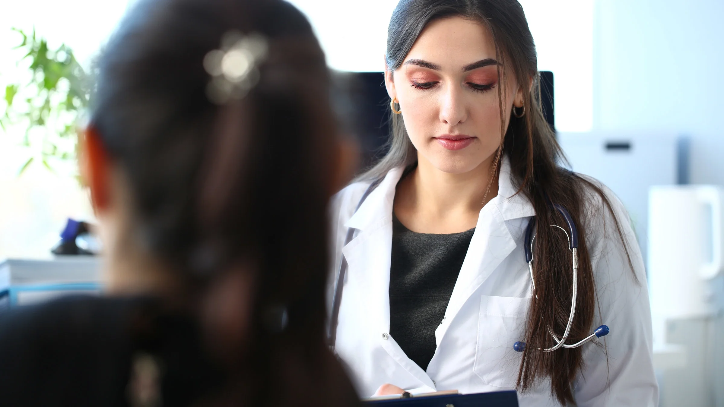 A doctor talking to a patient.