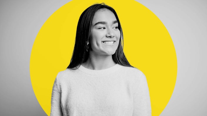 Black and white portrait of a young woman with straight hair. There is a bright yellow circle graphic added behind her.