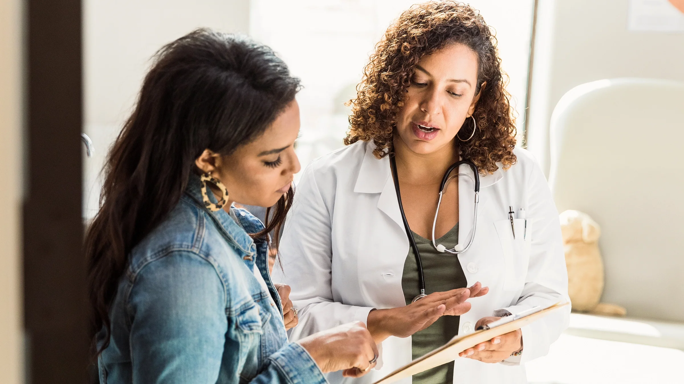 A healthcare professional discusses a patient's diagnosis.
