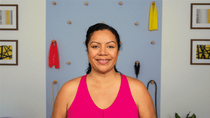 Woman demonstrating levator scapulae exercise while holding hand on back of head