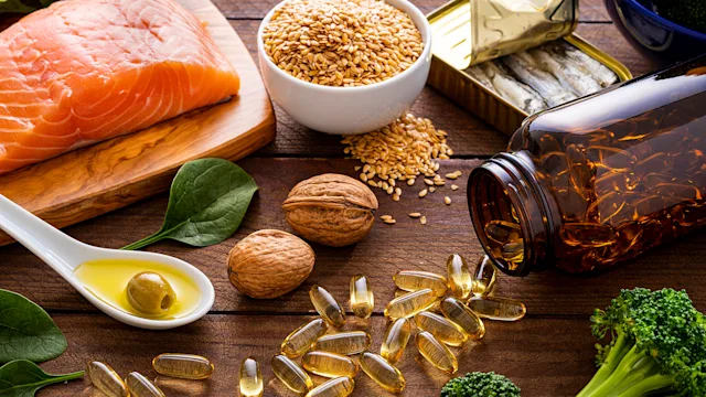 diet nutrition: overhead view with fish and supplements 1347857821