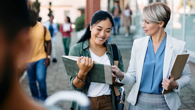 Pharmacists: Applying to school: professor and student walking-1346226355