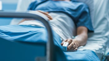 Health: Dermatology: person in hospital bed cropped-1046447804