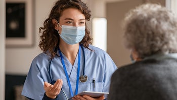 Phenytoin: Interactions: medical professional speaking to patient 1284869164
