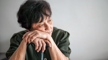 Senior Health: senior woman leaning on cane 1321258462