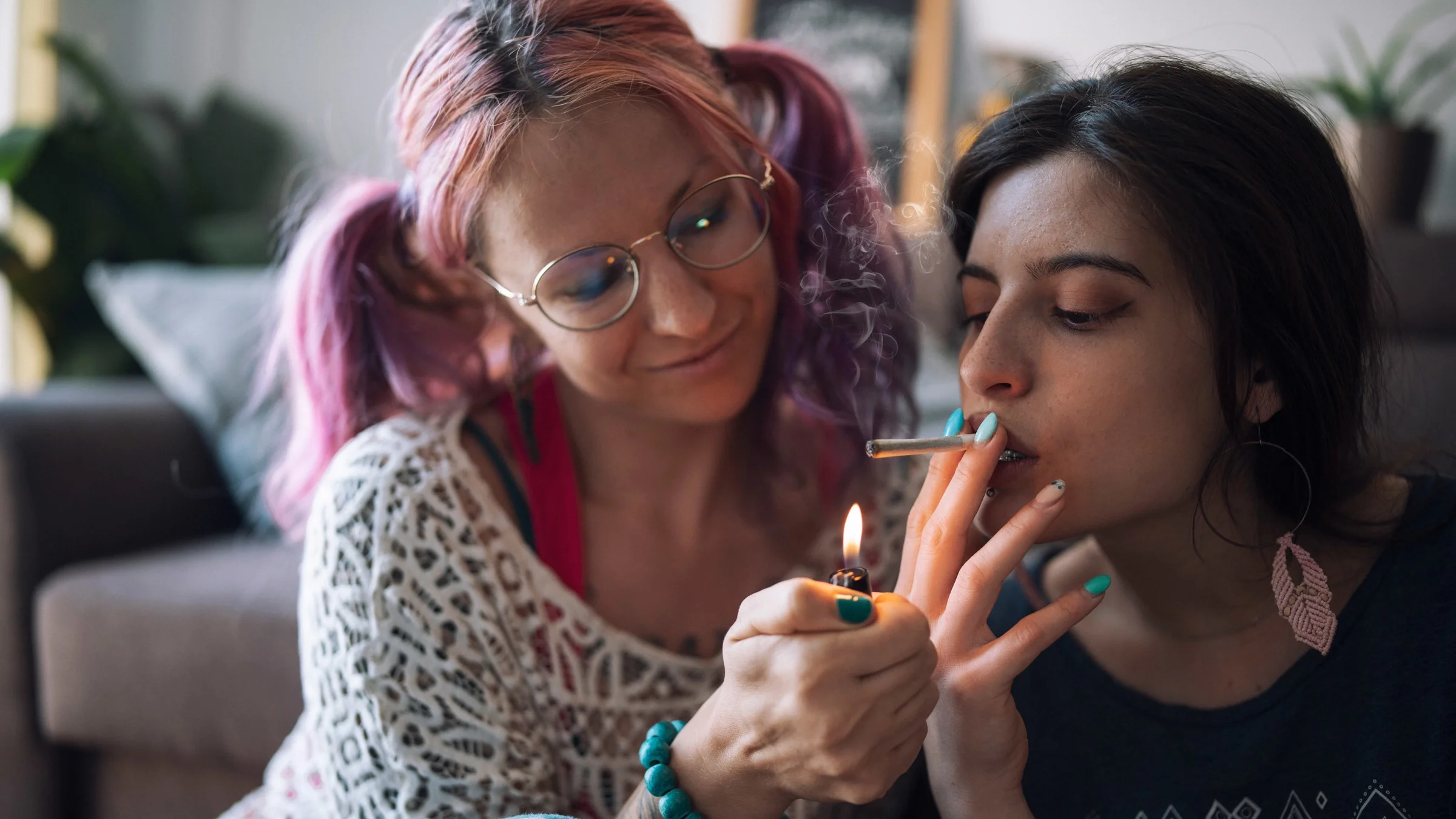 A queer couple smoking weed.