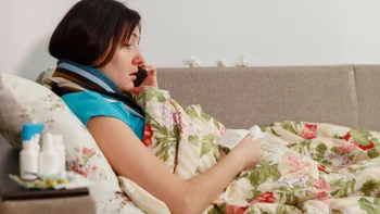 Sinus infection: sick person talking on phone 1011781834