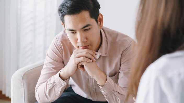 A depressed client speaking to a mental health professional.