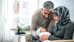 New parents holding their newborn
FatCamera/E+ via Getty Images
