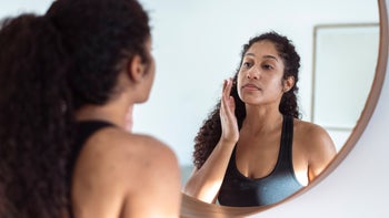 Dermatology: woman applying moisturizer 1321220585