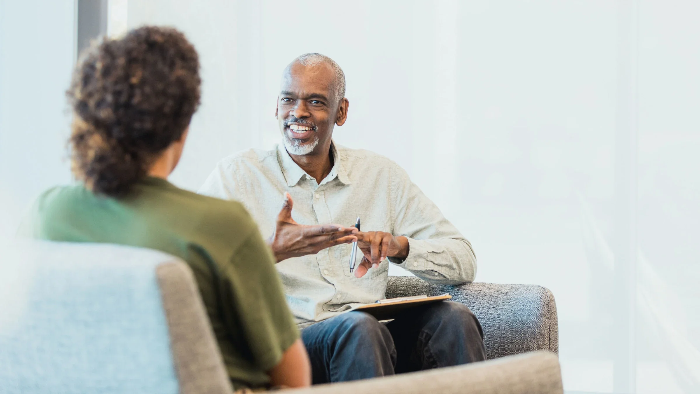 Therapist talks with a client.
SDI Productions/E+ via Getty Images