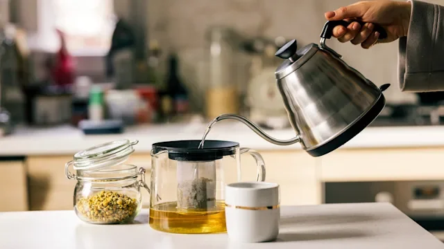 supplements-herbs: closeup brewing tea 1299171309